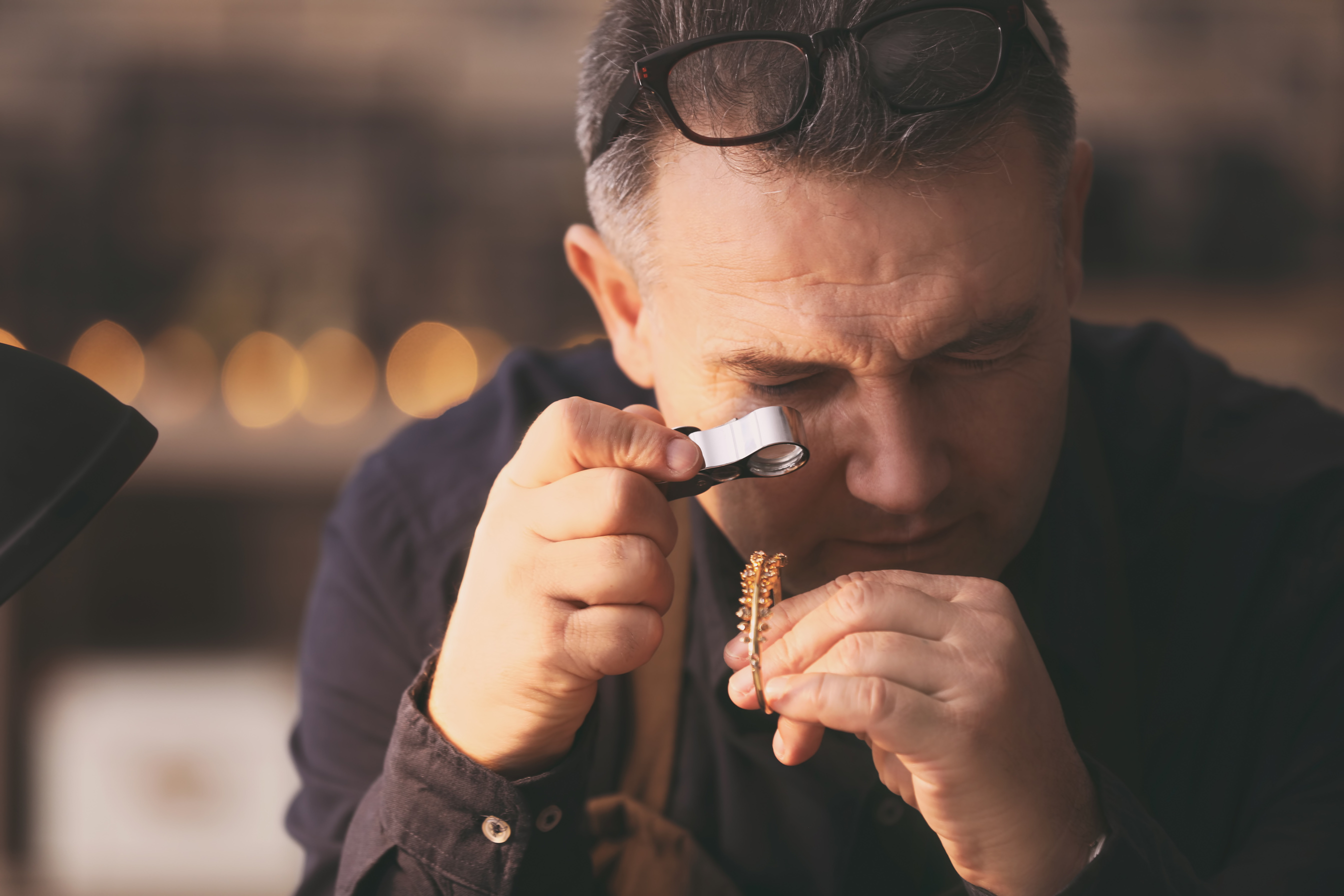 Jeweler Working in Workshop